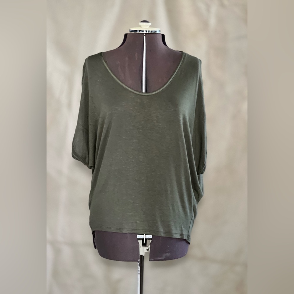 White House Black Market Olive Jetsetter Swing Tee with sleeve detail.